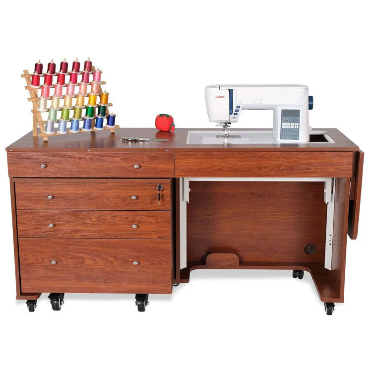 The Kangaroo & Joey Cabinet Set (available in 3 colors) features drawers and caster wheels, holds a sewing machine, a rack of colorful threads, scissors, and a red pin cushion on top, plus an open space beneath for easy access.
