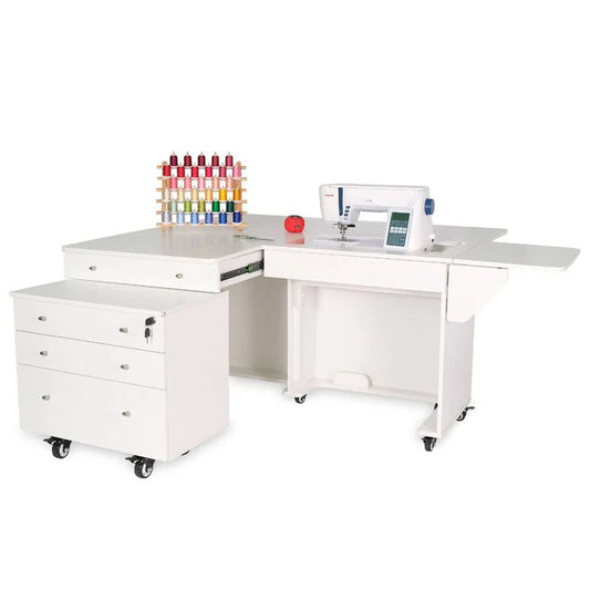A Quilted Joy Kangaroo & Joey XL Sewing Cabinet (available in 3 colors) features drawers, a wheeled extendable side table, electric lift for your sewing machine, thread spool rack, and organizer space for accessories like a pincushion.