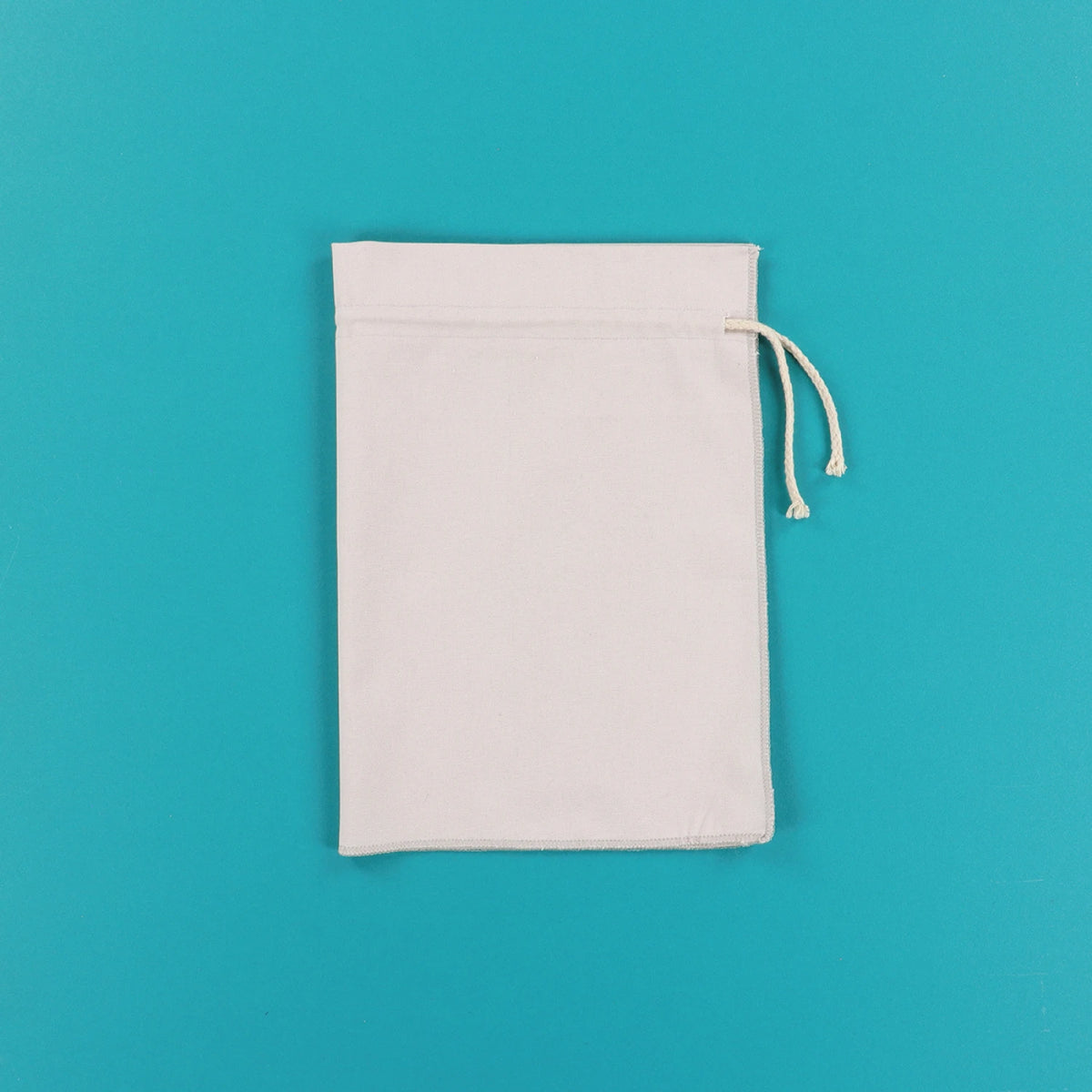 Single Kimberbell grey drawstring cinch sack shown upright on teal background