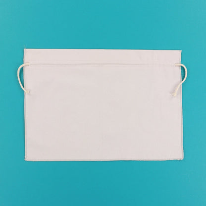 Kimberbell grey cinch sack shown flat with drawstring ends visible on teal background