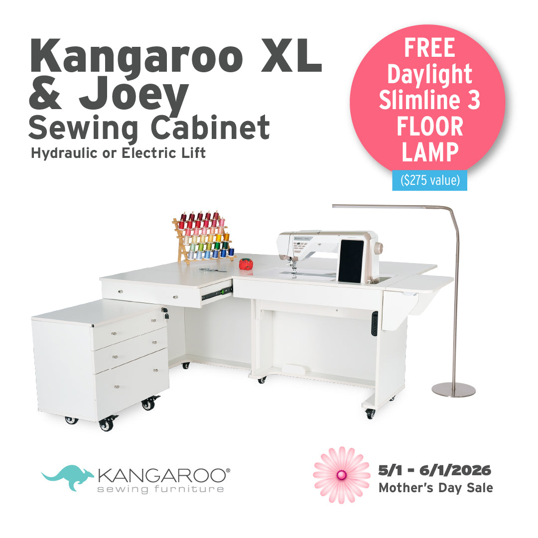 The Quilted Joy Kangaroo & Joey XL Sewing Cabinet (available in 3 colors) offers hydraulic or electric lift, storage for your supplies, and comes with a free floor lamp during our Mother’s Day sale, 5/1–6/1/2026. Quilted Joy logo shown.
