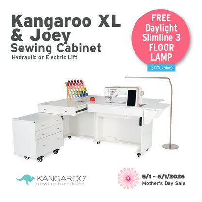 The Quilted Joy Kangaroo & Joey XL Sewing Cabinet (available in 3 colors) offers hydraulic or electric lift, storage for your supplies, and comes with a free floor lamp during our Mother’s Day sale, 5/1–6/1/2026. Quilted Joy logo shown.