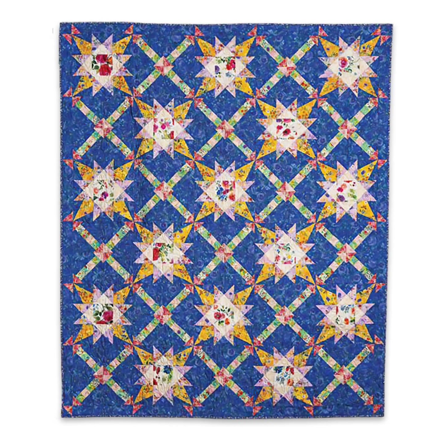 The Love of Quilting Lavender Roads Quilt Kit by Quilted Joy features a vibrant star pattern with floral centers on blue, accented by yellow and green lattice—an ideal PRESALE choice for Love of Quilting magazine fans.