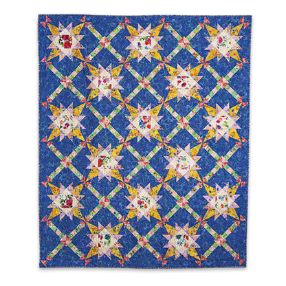 The Love of Quilting Lavender Roads Quilt Kit by Quilted Joy features a vibrant star pattern with floral centers on blue, accented by yellow and green lattice—an ideal PRESALE choice for Love of Quilting magazine fans.