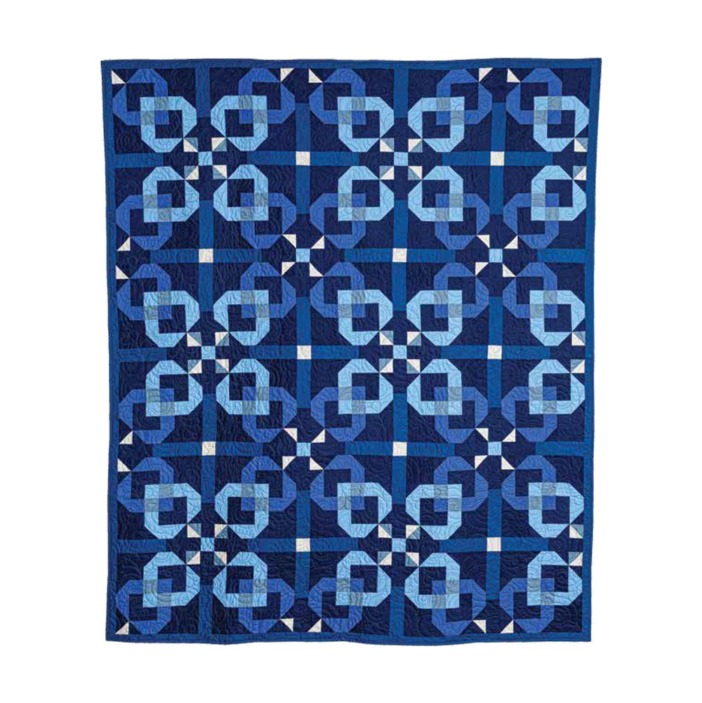 The Love of Quilting Blueberry Jam Quilt Kit by Quilted Joy is a handmade, vintage-inspired quilt with geometric interlocking shapes in blue and white, forming diagonal lines and diamond motifs.