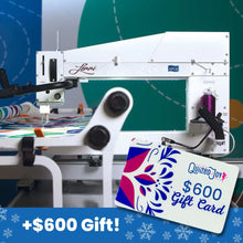 A longarm quilting machine is stitching a colorful quilt. In the foreground, there is a $600 Quilted Joy gift card. The bottom banner reads +$600 Gift! with snowflake icons.
