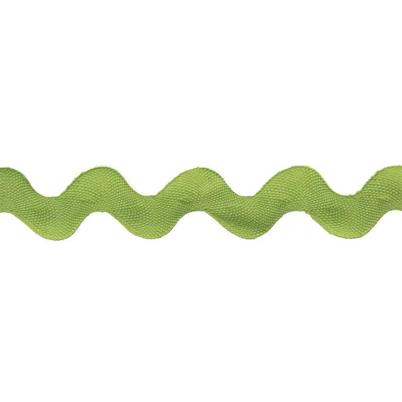 A close-up of Rick Rack 1-1/4" Wide, a green sewing embellishment with a wavy zigzag pattern, displayed on a white background.