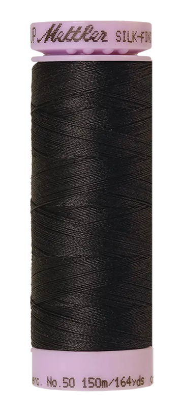 A spool of Mettler Cotton Silk Finish 50wt thread in Mole Gray, 150m/164yds, with light purple plastic ends.
