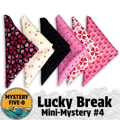 Six patterned bandanas in pink, black, and white with hearts and florals are shown, tying into Quilted Joy’s Mystery Five-O Love "Lucky Break" Fat Quarter Quilt Kit. Text: Lucky Break Mini-Mystery #4 and MYSTERY FIVE-O.
