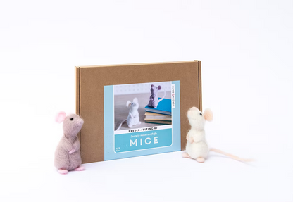 A brown box labeled "Mouse Needle Felting Kit 2ct" with an image of felt mice on the front is flanked by two felt mouse figurines, one gray and one white, all set against a white background.