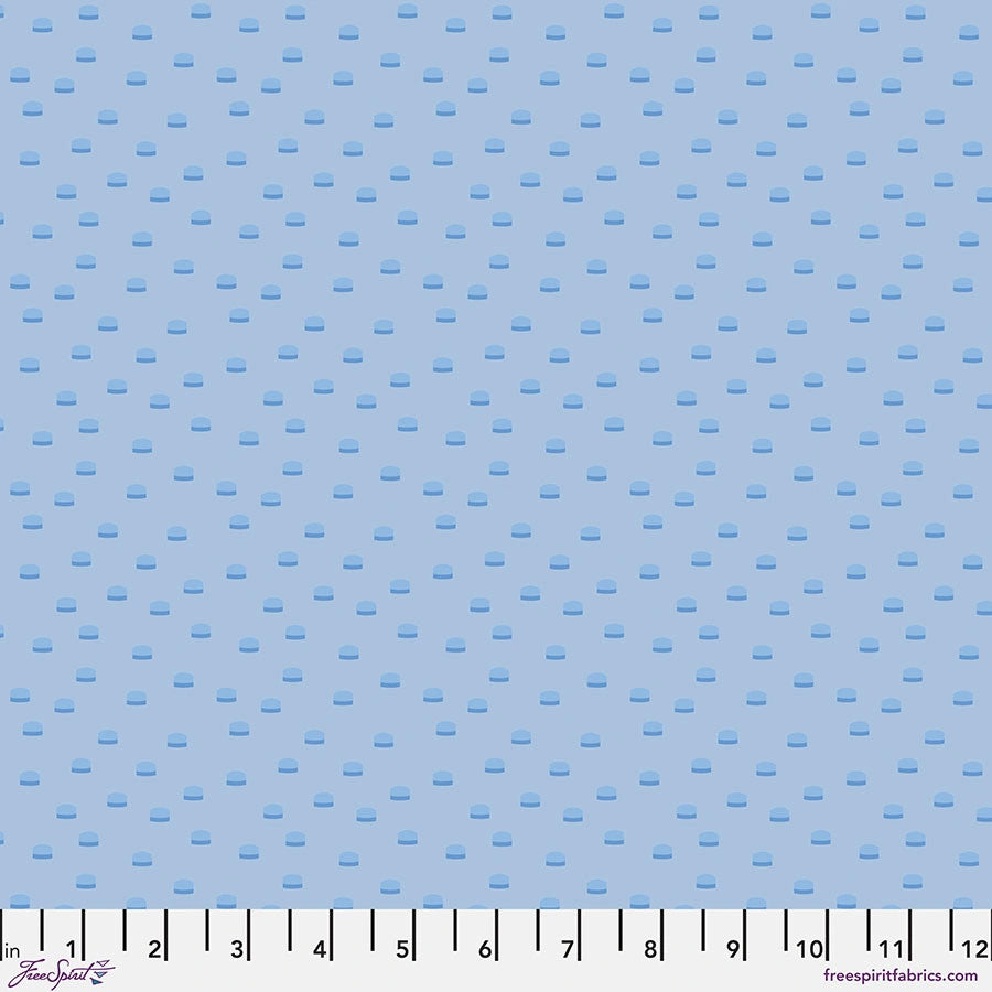 Chromatics Blue Toppers Fabric Yardage by Jaftex - FreeSpirit features light blue cotton with a repeating pattern of small, dark blue rounded rectangles and a ruler along the bottom edge marked 0-12 inches—perfect as a blender fabric.
