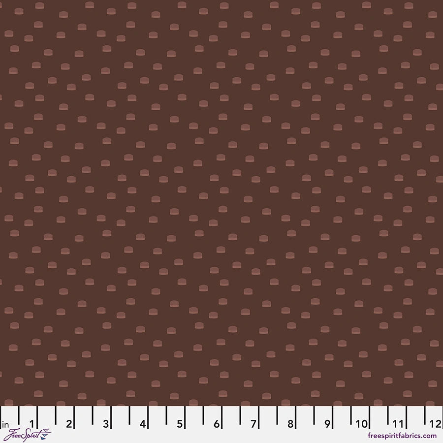Brown fabric with small, light brown rectangles, shown with a ruler in inches 1–12. Chromatics Brunette Toppers Fabric Yardage by Jaftex - FreeSpirit, 100% cotton quilting fabric. Brand and website text are visible.