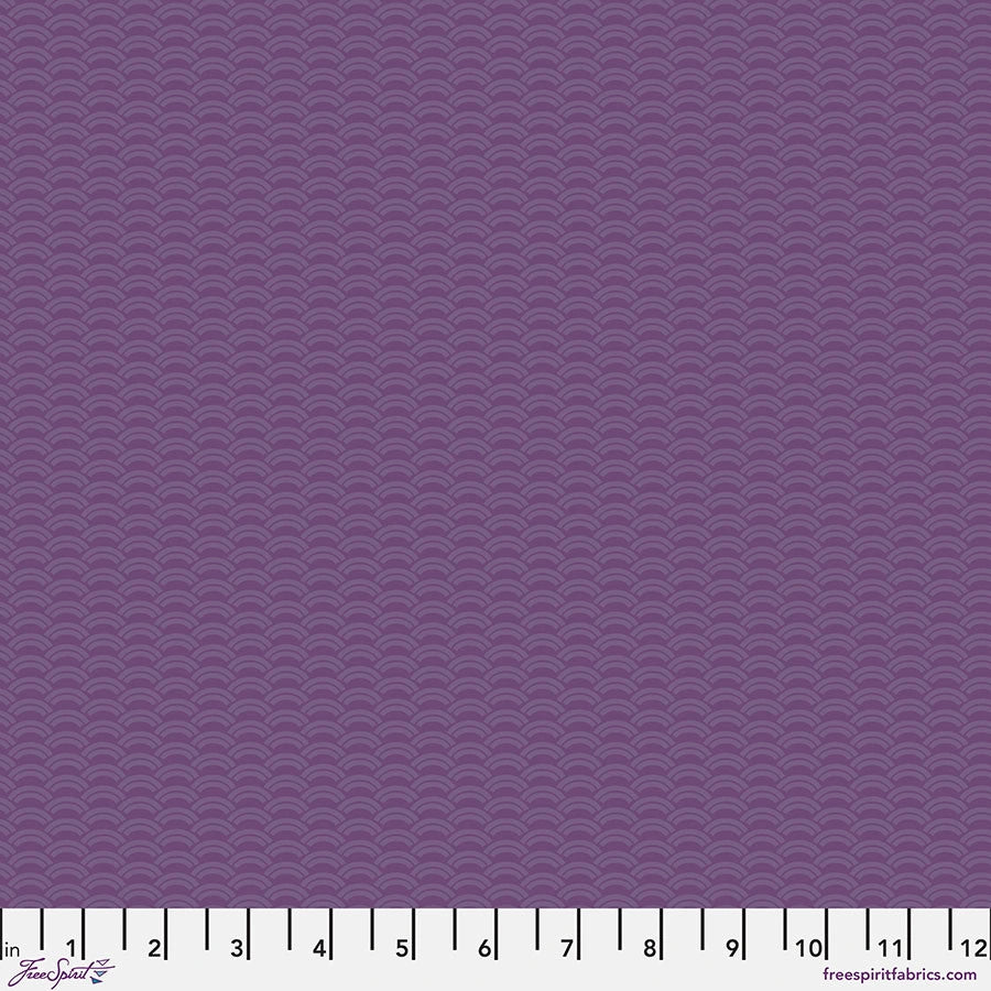 Jaftex - FreeSpirit Chromatics Plum Crescent Fabric Yardage features a purple scallop wave pattern on 100% cotton, offering a subtle textured effect. Shown with a ruler for scale, it's ideal for quilting projects.