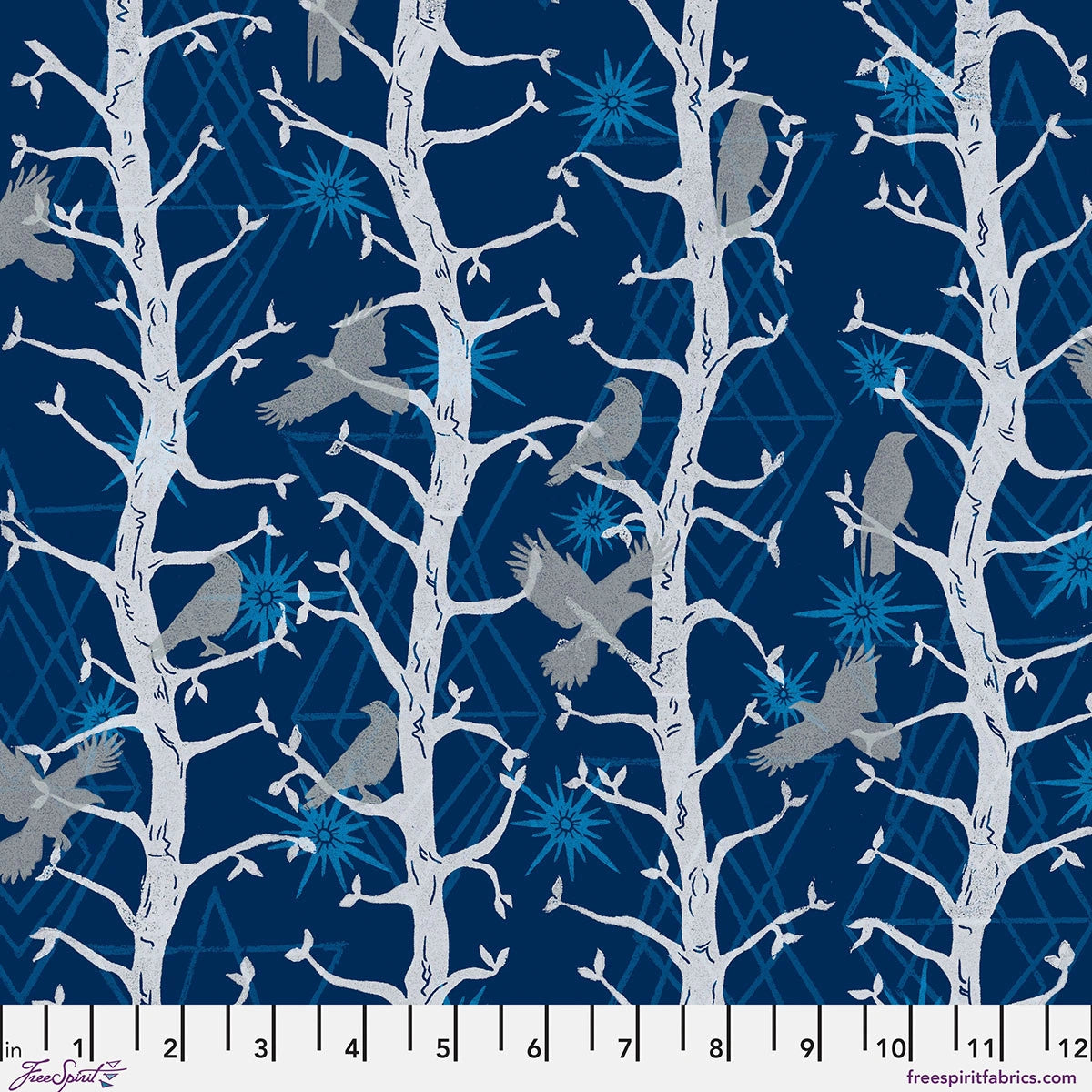 The Wisdom Indigo The Trees Fabric Yardage by Jaftex - FreeSpirit features white tree branches with grey birds and light blue starbursts on deep indigo cotton, plus a ruler at the bottom marking inches for scale.