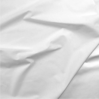 A close-up of Cotton Sateen White 118" Wide Quilt Backing Fabric highlights its smooth texture and soft folds—perfect for quilt backing or any project needing extra-wide, high-quality cotton sateen.