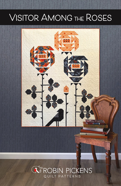 Visitor Among the Roses quilt pattern with oversized pieced roses and bird