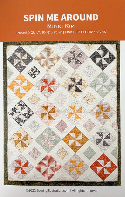 The Spin Me Around Quilt Pattern by Checker Distributor features colorful pinwheel blocks made from half-square triangles, set in rows on white with a green border. Finished size: 60½" x 75½"; block size: 15" x 15".