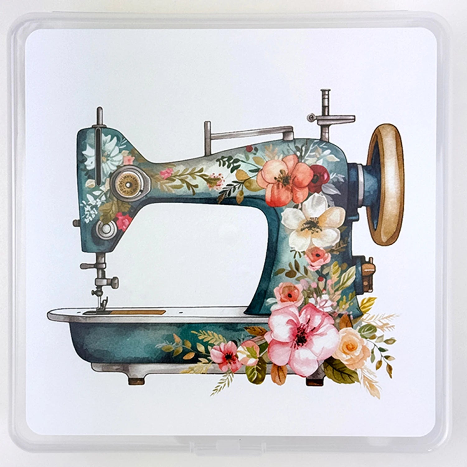 An illustration of a vintage sewing machine with vibrant floral designs, ideal for enhancing your sewing space or displaying with the Summit Street Storage Box - My Bestie by Checker Distributor, set on a plain white background.