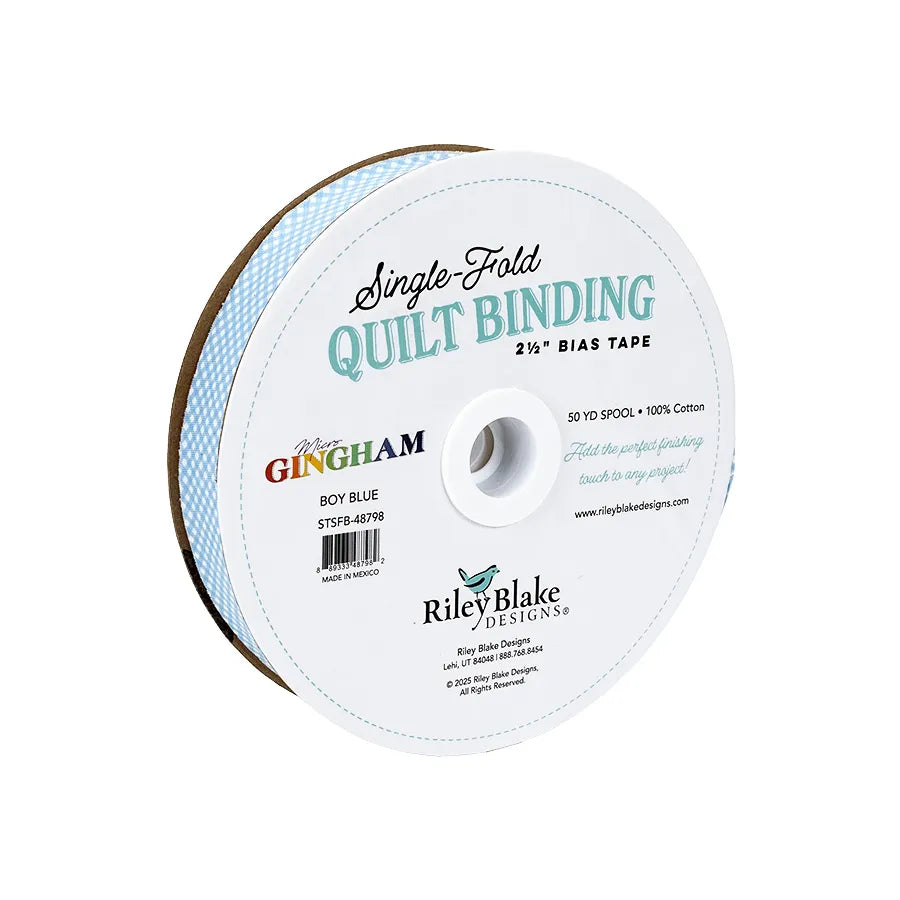 Riley Blake Micro Gingham Boy Blue 2.5" bias quilt binding, 100% cotton, on a white spool with blue and black text.