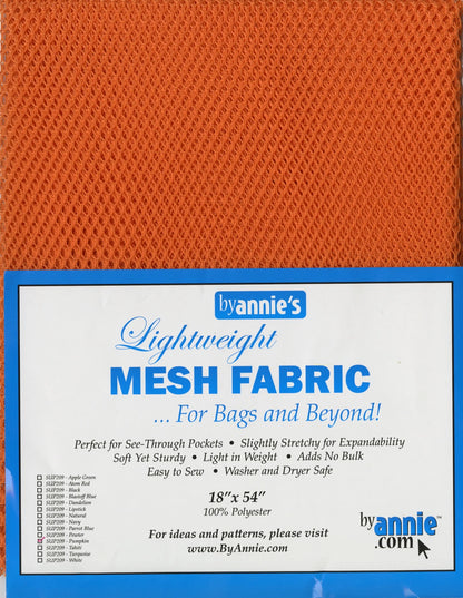 An 18in x 54in orange Mesh Lite Weight Pumpkin fabric is shown in packaging labeled byAnnies, with details on size, material, and recommended uses for bags and accessories. Perfect for sewing projects.