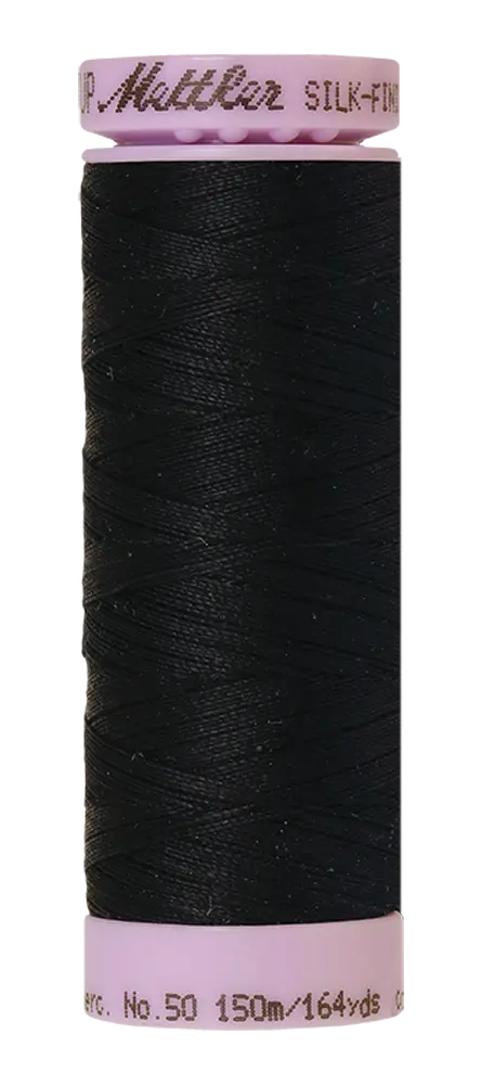 A spool of Mettler Cotton Silk Finish 50wt quilting thread, 150m in Space (black), features pink ends and is labeled “Mettler Silk-Finish” at the top with “No. 50 150m/164yds” at the bottom.