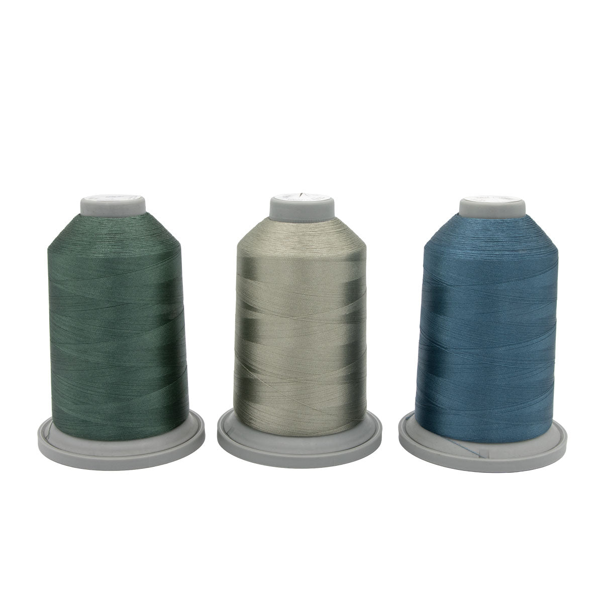 The Stormy Sprite Glide Thread of the Month Bundle by Hab+Dash by Fil Tec features three large spools in green, light gray, and blue on gray bases, displayed against a white background.
