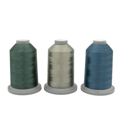The Stormy Sprite Glide Thread of the Month Bundle by Hab+Dash by Fil Tec features three large spools in green, light gray, and blue on gray bases, displayed against a white background.