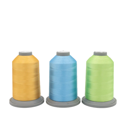 Three large spools of Hab+Dash by Fil Tec thread in yellow, blue, and light green stand upright on gray bases against a white background—ideal for your Sugar Stitches Glide Thread of the Month Bundle.