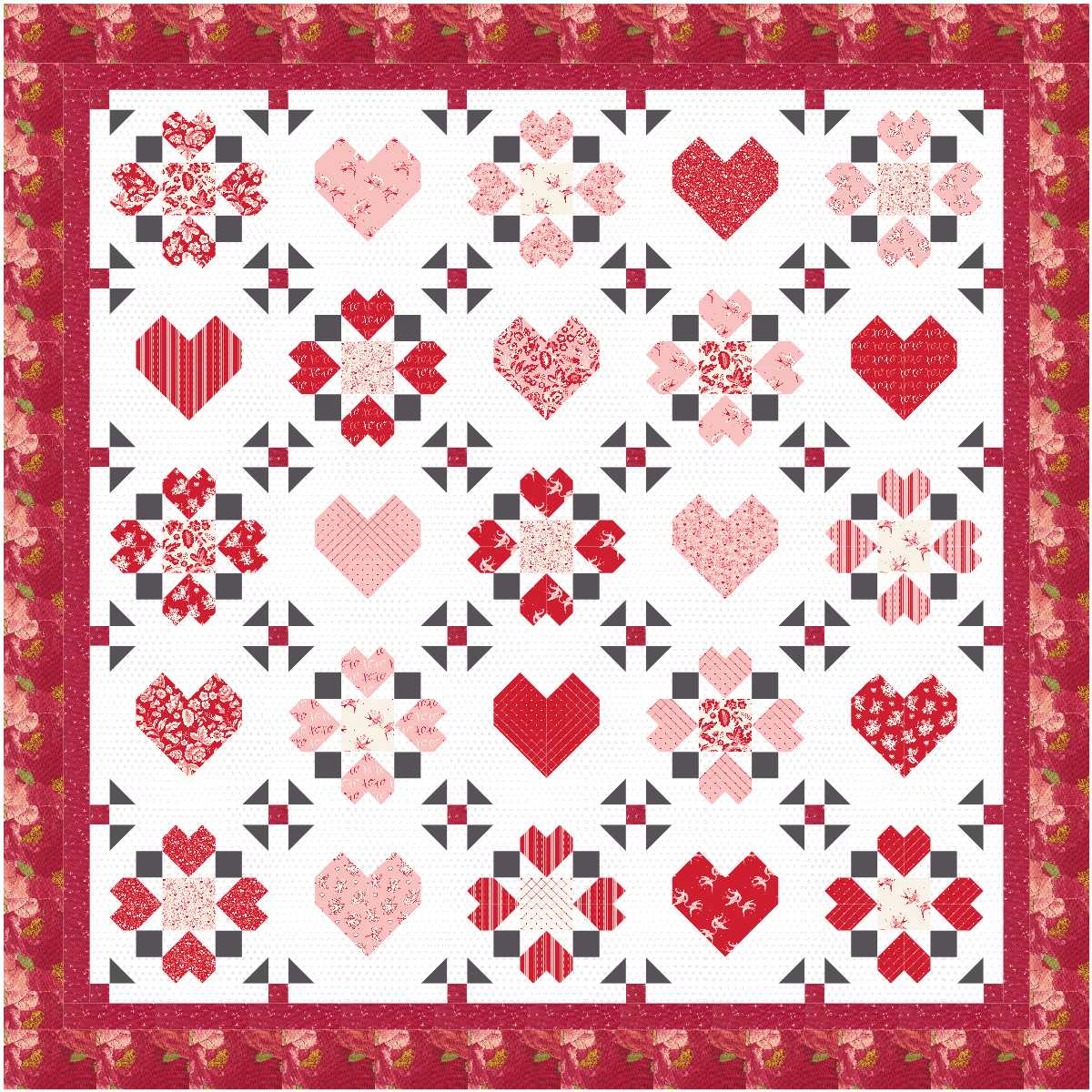 A red and white quilt kit by Quilted Joy, the Surrounded By Love Quilt Kit, features heart patterns and star florals in alternating blocks, accented by a decorative red floral border for a charming finish.