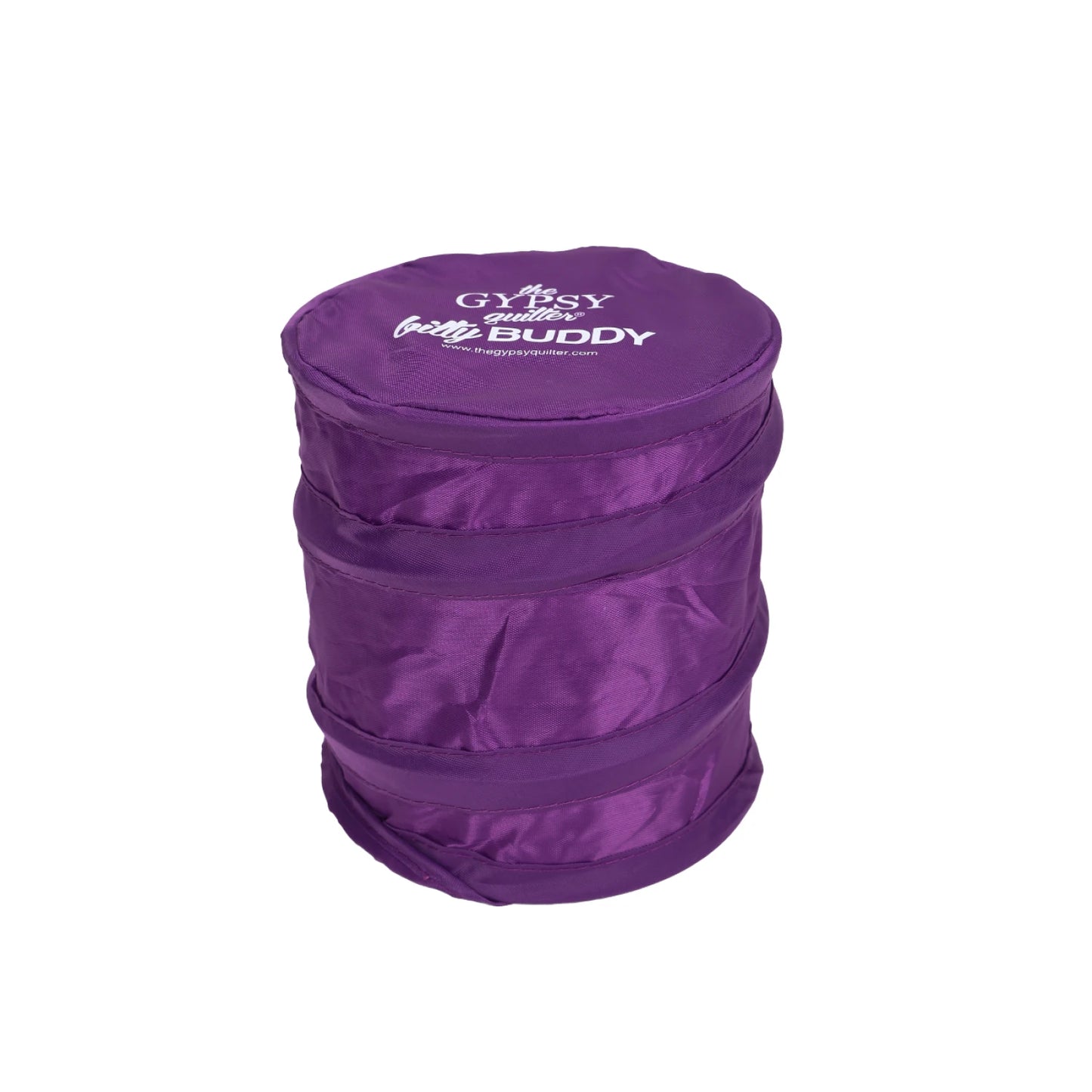 The Gypsy Quilter Bitty Buddy by Checker Distributor is a collapsible, round, purple fabric scrap collector with a white logo on top—perfect for sewing and quilting projects.