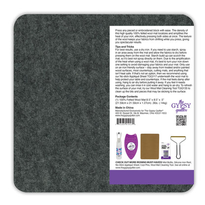 The Checker Distributor Wool Pressing Mat 8-1/2in x 8-1/2in x 1/2in thick is a gray, square quilting pad with info, usage tips, care instructions, contents, and branding on a white label in the bottom right corner.