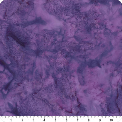 A 108" wide square of Hoffman 1895 Watercolors Agate Batik quilt backing fabric with a marbled purple and lavender pattern. A white ruler along the bottom edge shows measurements in inches for this 3 yard sample.