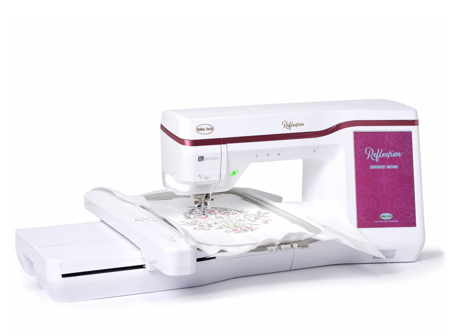 A modern white and pink Baby Lock Reflection Sewing & Embroidery Machine with a digital display is stitching a floral pattern on fabric in an embroidery hoop; it includes a large embroidery field and FREE 60 days of online classes.