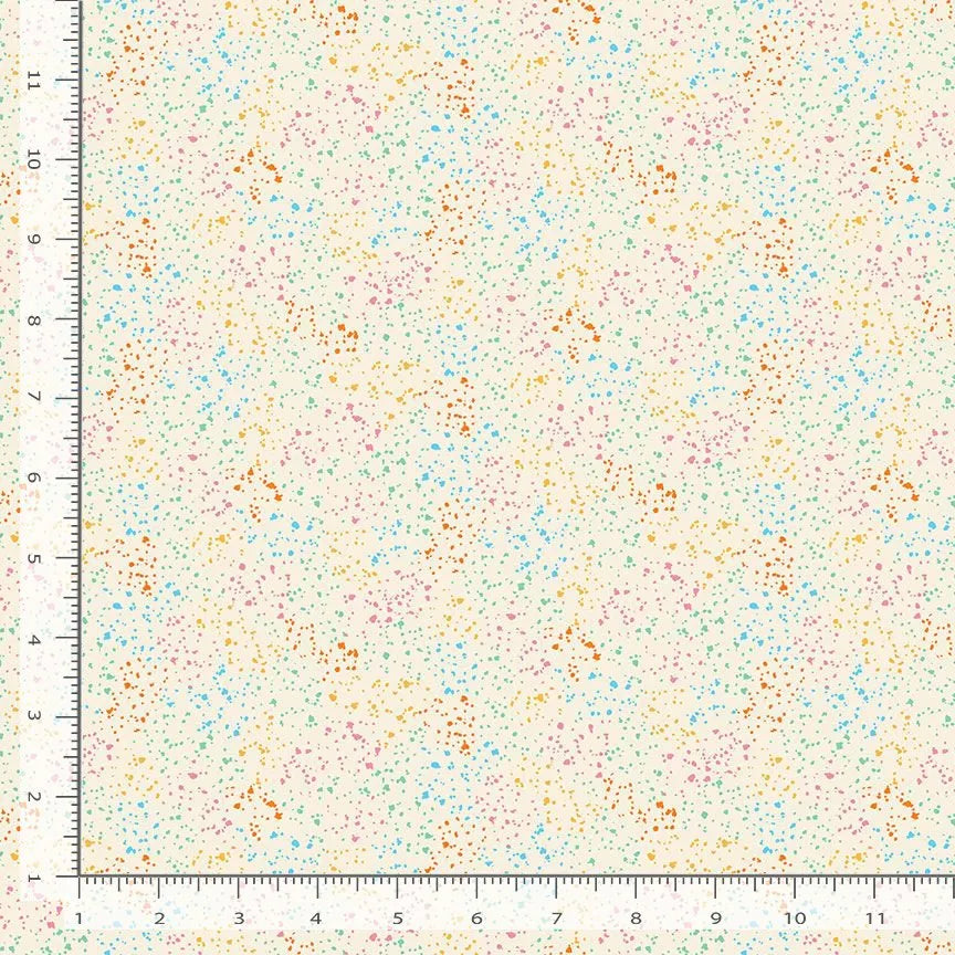 A ruler frames two edges of a Dear Stella Stardust Rainbow 108" Wide 3 Yard Quilt Fabric Back Pack sample, featuring a cream background with scattered orange, blue, pink, and green dots. The cotton swatch is about 12" x 12".