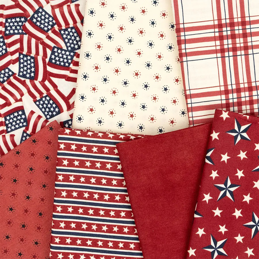 Celebrate with the America 250 Years Mini Charm Pack by United Notions—six patriotic fabrics featuring flags, stars, stripes, polka dot stars, plaid, and solid red in classic red, white, and blue.