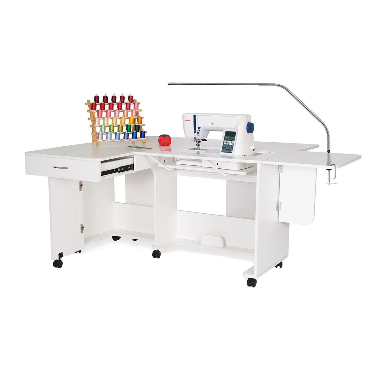 The Arrow Christa Sewing and Quilting Machine Cabinet by Arrow Companies, LLC features an adjustable lift, extendable work surface, lamp, organized storage drawers, and a thread rack for multiple colorful spools.