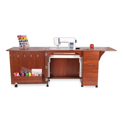 The Arrow Harriet Sewing and Quilting Machine Cabinet by Arrow Companies, LLC offers an open design with sewing machine storage, drawers, thread spool and tool space, a fold-out table extension, ample storage, and wheels for easy mobility.