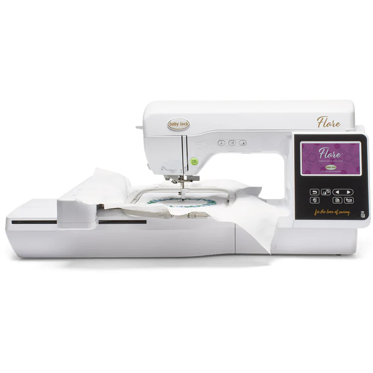 The Baby Lock Flare Dedicated Embroidery Machine with FREE Online Classes is embroidering a design with elegant fonts on white fabric held in a hoop, as shown on its digital touchscreen display.