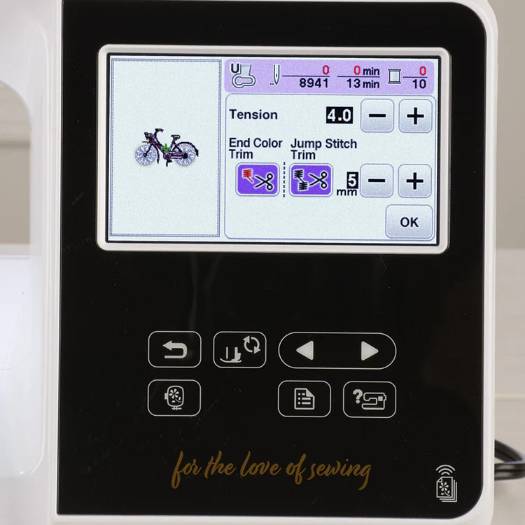 The Baby Lock Flare Dedicated Embroidery Machine with FREE Online Classes features a digital display showing a bicycle design, tension at 4.0, trim options, embroidery fonts, various buttons and icons, and "for the love of sewing" below the screen.