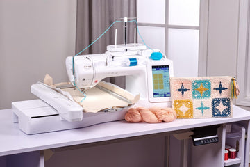 Baby Lock Ursa sewing embroidery machine lifestyle on couch