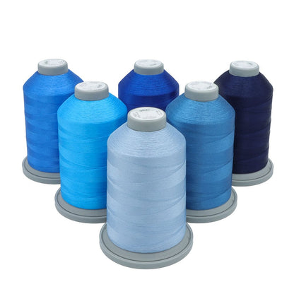 Glide Thread Color Block Bundle - Blue - six cones of blue Glide thread on a white background