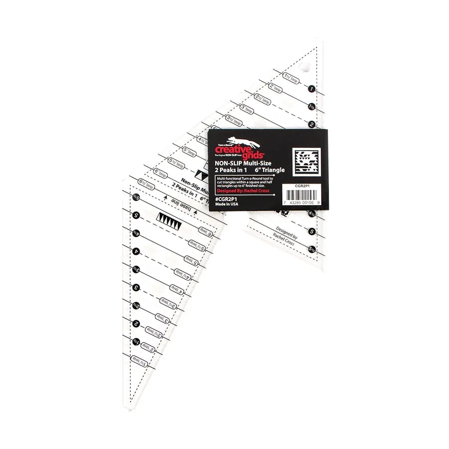 The Checker Distributor Creative Grids Quilt Ruler 2 Peaks in 1 Triangle is a transparent, triangular quilting ruler with black markings and measurement lines, ideal for triangle in a square blocks. It includes a non-slip grip and features a black label at the top.