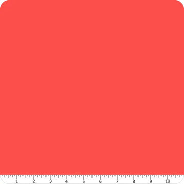 A 10-inch wide square of Riley Blake's Confetti Cotton™ Cayenne Solid Fabric Yardage is displayed on a white background, with a ruler at the bottom for scale.