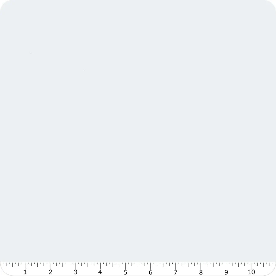 A plain white background with a black ruler (0–9 inches, inch and half-inch marks) and rounded top corners—ideal for displaying Riley Blake’s Confetti Cotton™ Iceberg Solid Fabric Yardage.