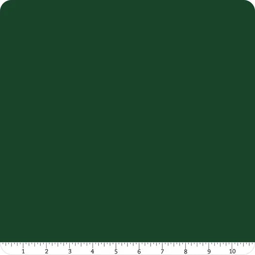 A green square with rounded corners and a white ruler from 1 to 10 inches—ideal for measuring quilting cottons like Riley Blake’s Confetti Cotton™ Woodland Fabric Yardage.