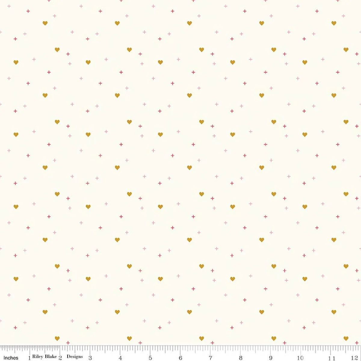 A cream background with small gold hearts and tiny pink plus signs scattered evenly. An inch-marked ruler runs along the bottom for scale. This is the Sparkler Cloud Heart Fabric Yardage by Riley Blake.