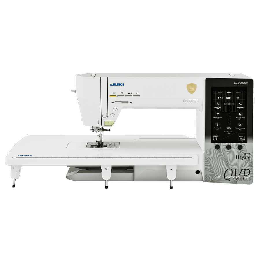 The JUKI Hayate DX-4500QVP with its wide extension table fitted, showing the 7 inch touchscreen on the right of the head.