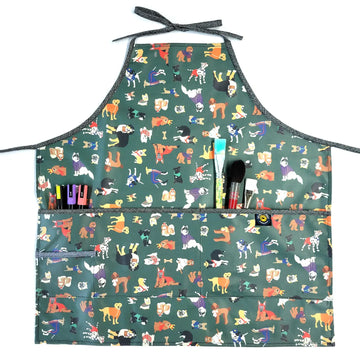 Full Apron in Laminated Cotton, Yard Dogs in Green - image 1 - quilting supply from Quilted Joy