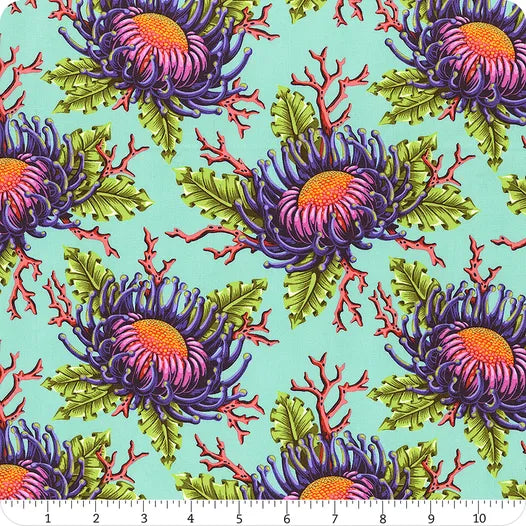 A repeating pattern of vibrant flowers and green leaves with red coral accents on a light blue background. Ideal for quilting, Floral Reef Seafoam Friends & Anemones Fabric Yardage by Jaftex - FreeSpirit shows scale in inches at the bottom.