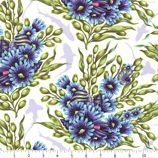 Floral Reef Marine Shadow Sharks Fabric Yardage by Jaftex - FreeSpirit features large blue and purple flowers with green leaves on quilting cotton, pale shark silhouettes in the background, and a ruler showing inches at the bottom.
